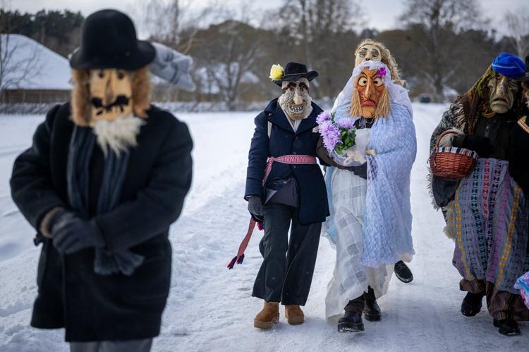 Photos show masked revelers celebrating Shrovetide in Lithuania