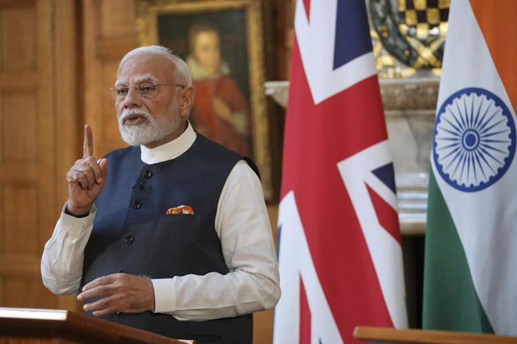 Photos of Britain's Starmer and India's Modi sealing a major trade agreement
