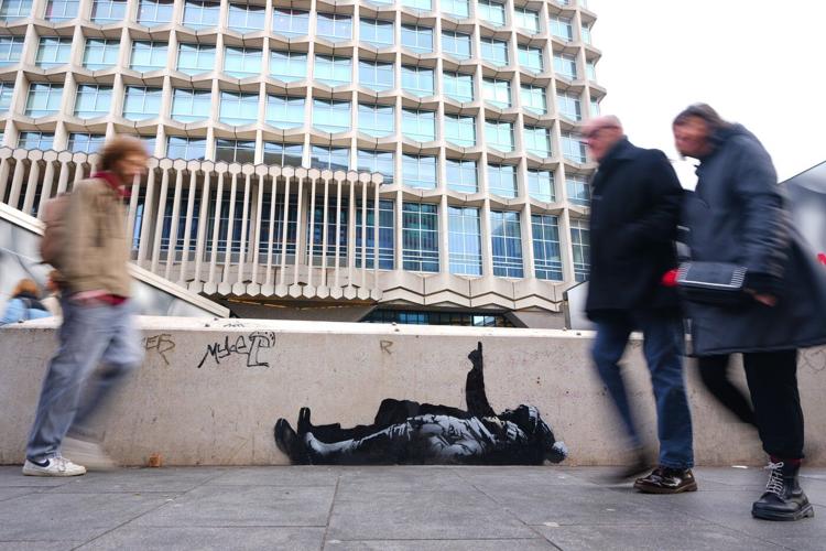 Banksy unveils new art in London following speculation over murals depicting stargazing figures