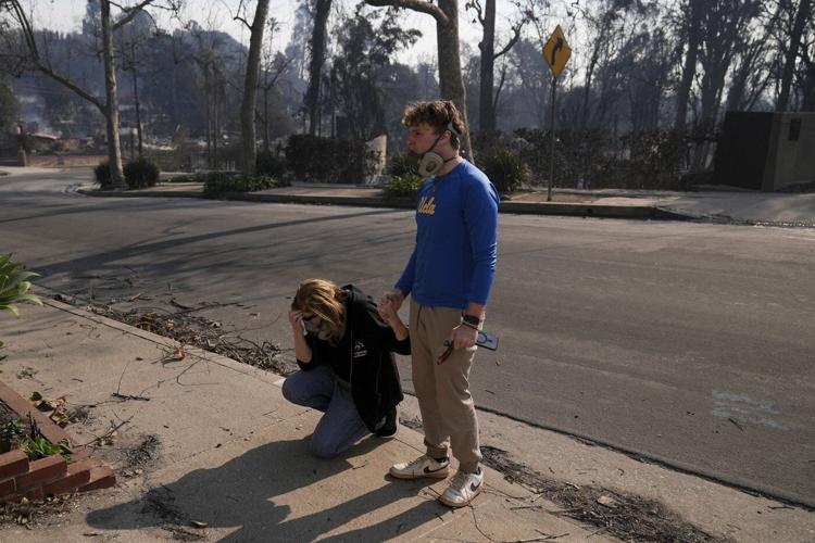Fires devastating Los Angeles grow more slowly as fierce winds die down