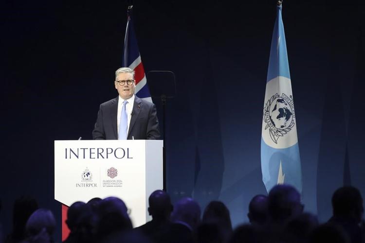 UK leader tells Interpol meeting world must 'wake up' to threat from people-smugglers