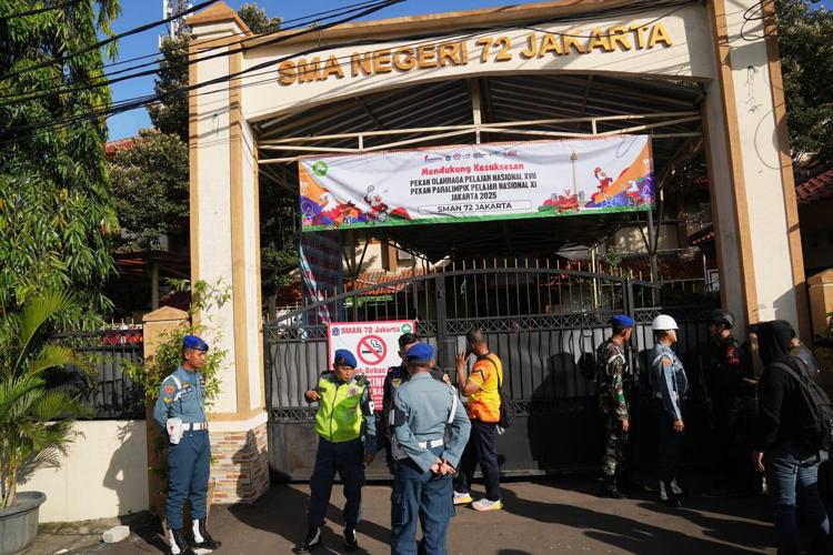 Multiple explosions shake a mosque in an Indonesian high school and injure 54