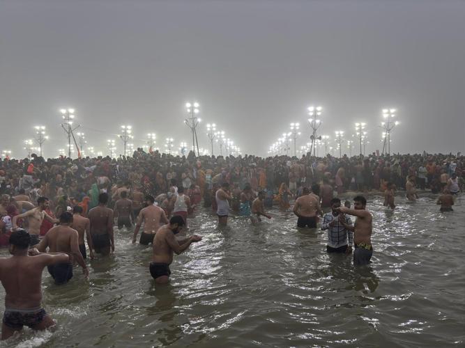Naked, ash-smeared Hindu ascetics take holy dips at the Maha Kumbh festival