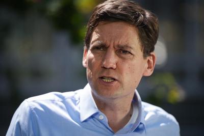David Eby calls banners over B.C. highway 'hateful' and 'reprehensible'