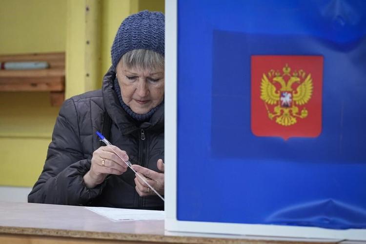 Russians cast ballots on Day 2 of an election preordained to extend Putin's rule