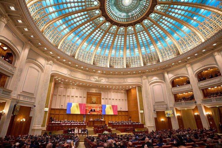 Romania's new president is sworn in as a political crisis eases, but challenges loom