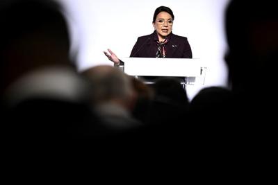Honduras' president is asked to resign after corruption scandal she says is a plot to oust her