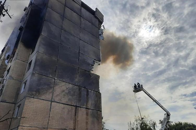 Russian missiles strike an apartment building, killing at least 4 in Ukrainian leader's hometown
