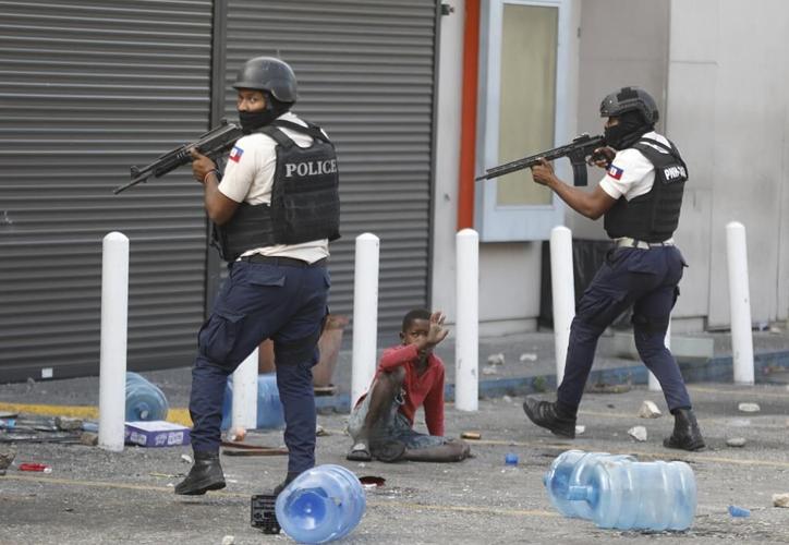 Official says police in Haiti killed 5 armed environmental protection agents during ongoing protests