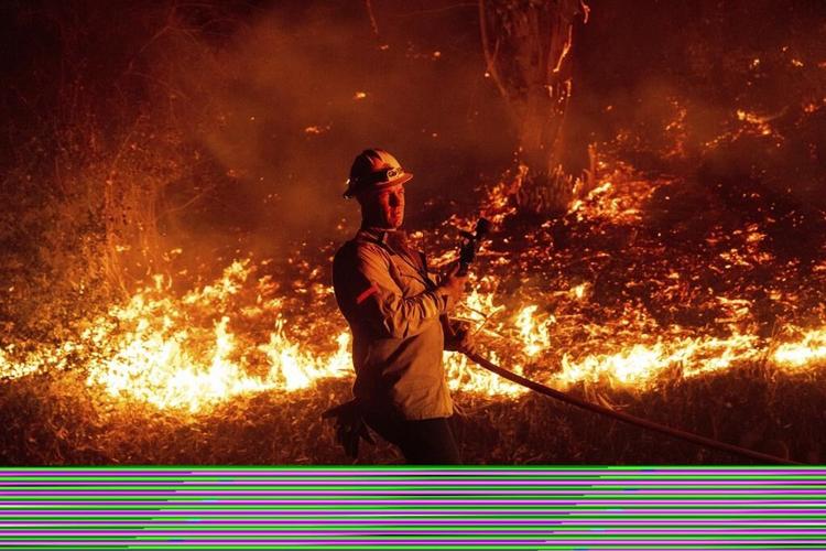 Southern California wildfire destroys 132 structures as officials look for fierce winds to subside
