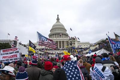 Man who stormed Capitol with dad gets 2 years in prison
