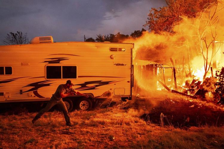 A wildfire sweeps through a historic California gold-mining town in photos
