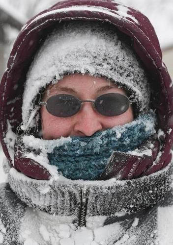 Major winter storms dump on California, Upper Midwest