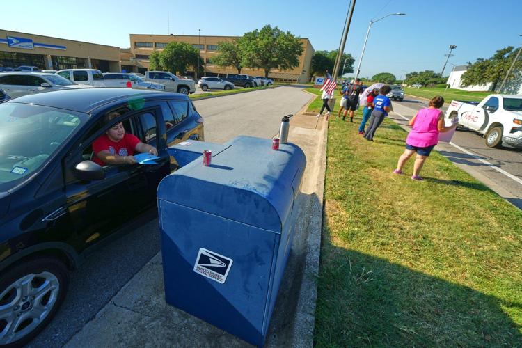 Trump's attacks on mail balloting and concerns over delays turn midterms spotlight on Postal Service