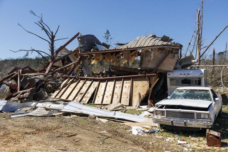 Residents pick up the pieces after devastating storms scour the US South and Midwest