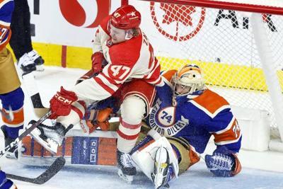 Oilers win 13th straight by dousing Flames 3-1