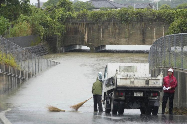 Heavy rains in southern Japan cause flooding and mudslides, and leave several people missing