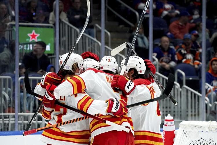 Dobson scores in OT to rally Islanders past Flames, 4-3