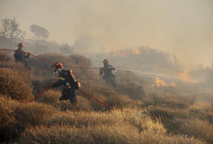 Firefighters race to contain wildfires in Greece as thousands evacuated, 2 die in Turkey