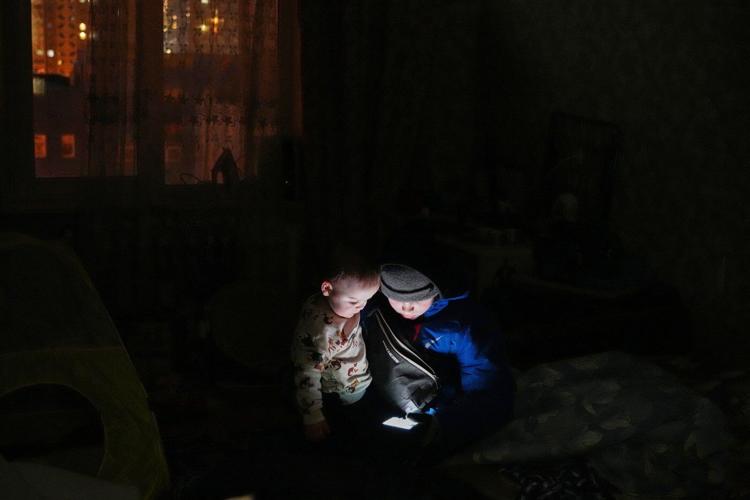 In the Ukrainian capital, a mother struggles to keep her children warm and fed amid power outages