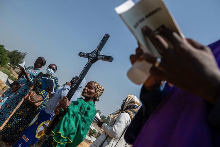 Mourners bury a 6-month-old Ebola victim, marking third orphanage death as Congo outbreak spreads
