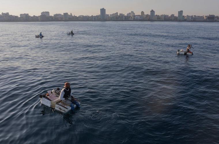 Ingenuity at sea: Cubans use makeshift rafts known as 'corchos' to catch elusive fish