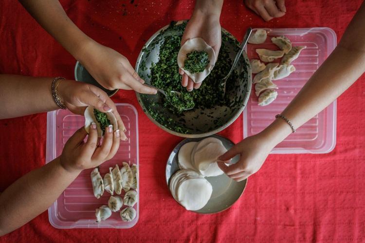 Photos follow the color red through public and intimate spaces during the Lunar New Year