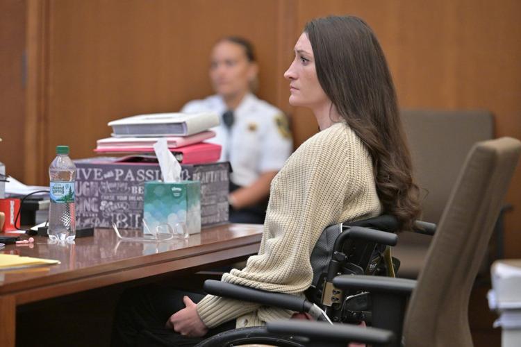 Women in pink rally in support of Lindsay Clancy who is on trial for killing 3 children