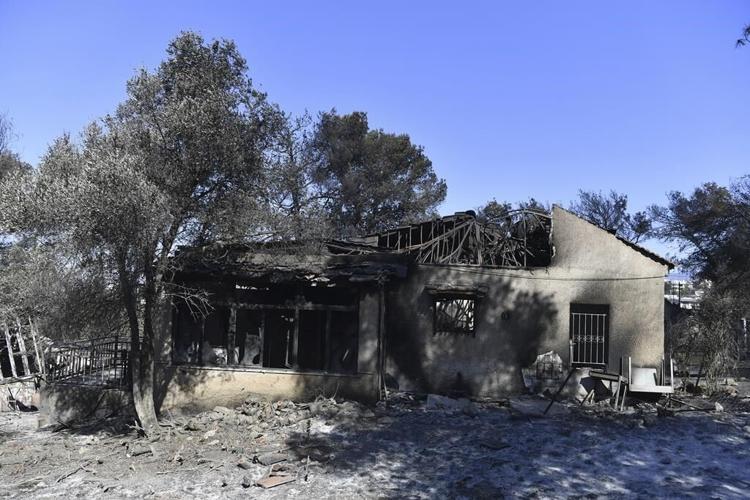 Crews battle scattered fires in Athens suburbs, helped by calmer winds and reinforcements