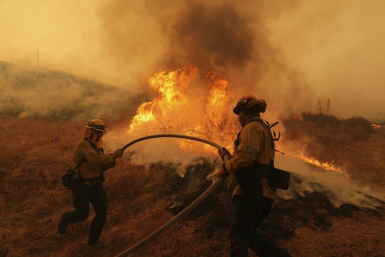Rapidly spreading brush fire prompts an evacuation order for thousands north of Los Angeles