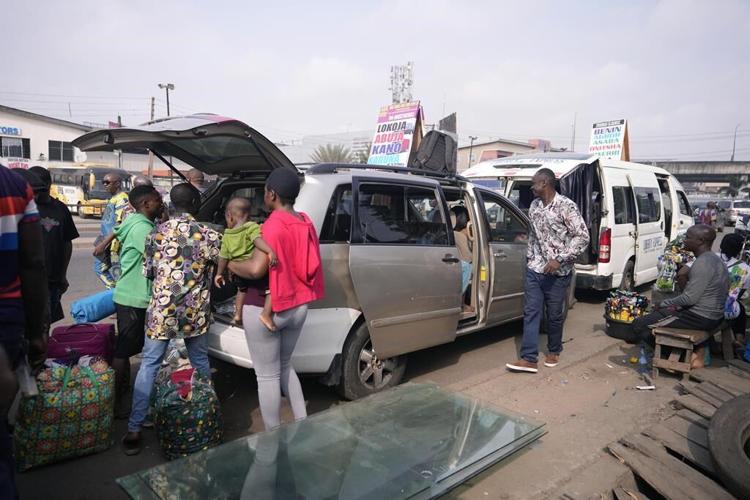Nigeria slashes transport fees during the holidays to ease some of the pain of austerity measures