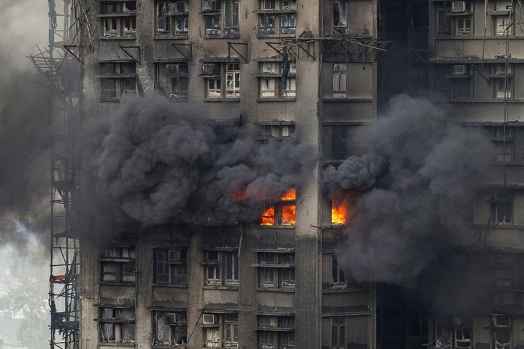Fire that killed at least 44 burns in Hong Kong towers for a second day