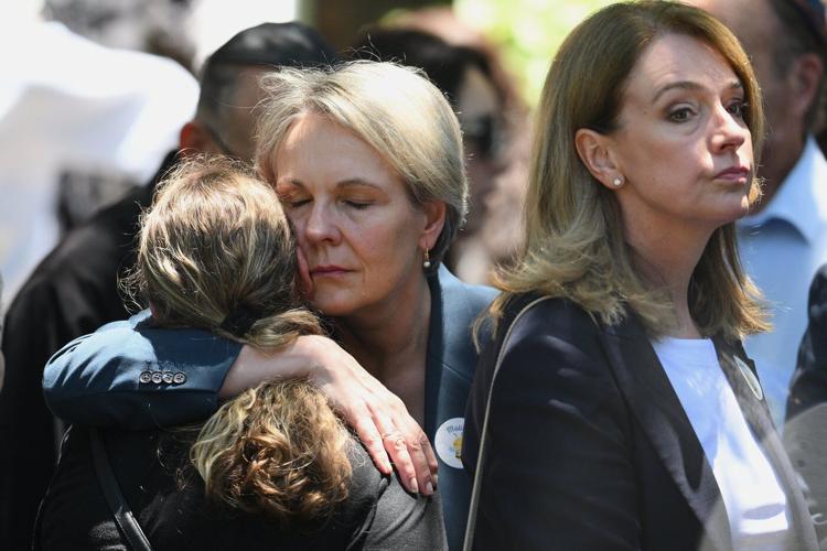 Mourners grieve 10-year-old slain in Bondi mass shooting as Australia's leader pledges new hate laws