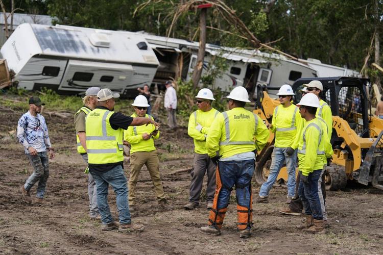 Photos of search crews racing against time as Texas flood deaths top 100