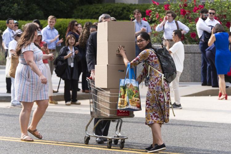 Photos of US State Department workers getting hugs and applause as they're fired