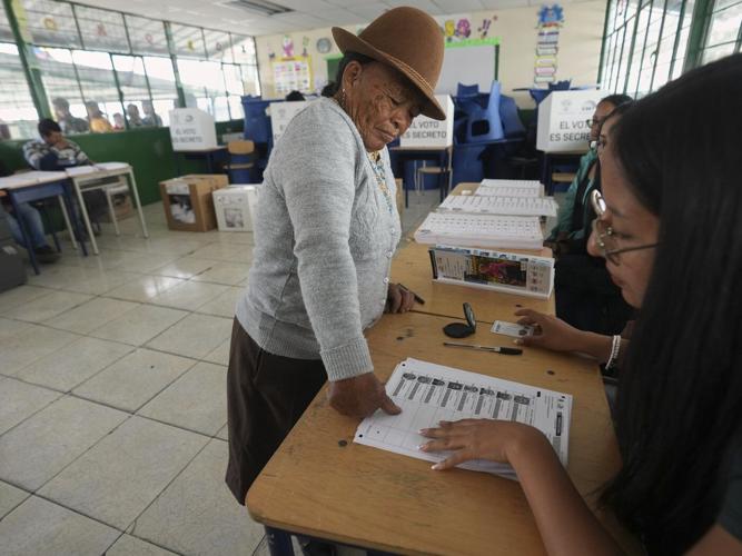 Ecuador votes for president, with the conservative incumbent and a leftist lawyer in the lead