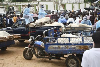 Boko Haram militants on motorcycles attacked a Nigerian village, killing over 100, residents say