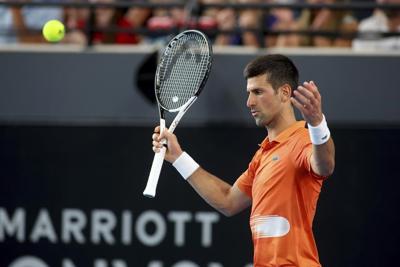 Djokovic shrugs off injury scare, wins Adelaide title