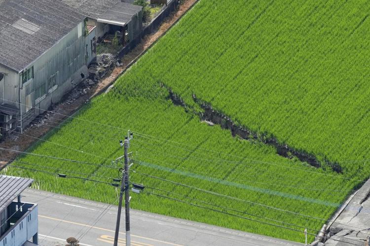 Rescuers search for the missing after Japan earthquake as death toll rises to 13