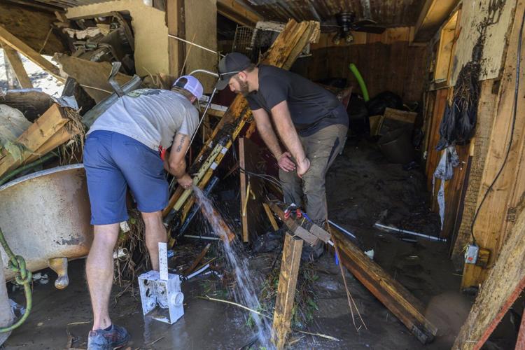 Flash flooding that killed 3 leaves New Mexico village heartbroken, anxious as cleanup begins