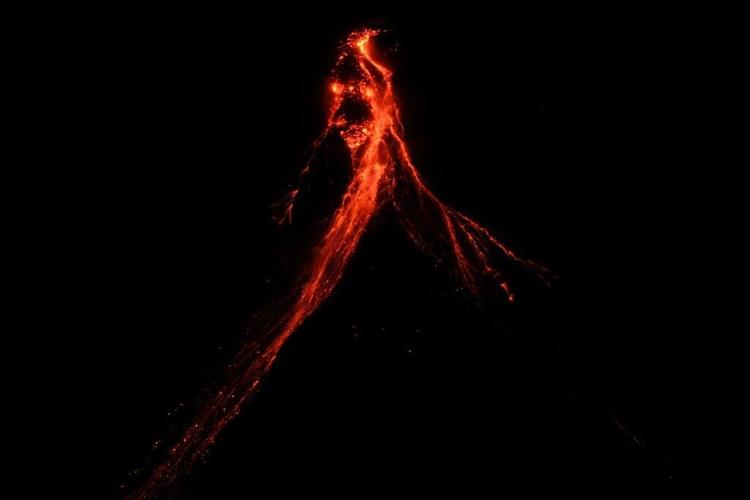 Philippines' Mayon Volcano spews lava down its slopes in gentle eruption putting thousands on alert