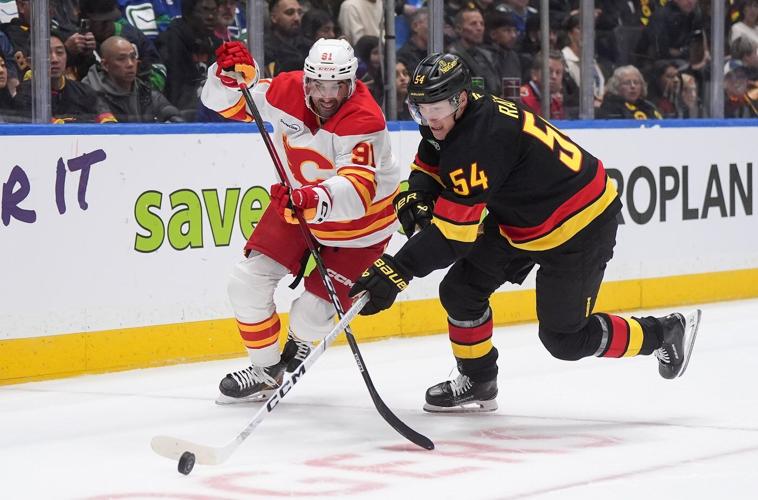 Chytil scores two, Vancouver Canucks dump Calgary Flames 5-1 in season opener