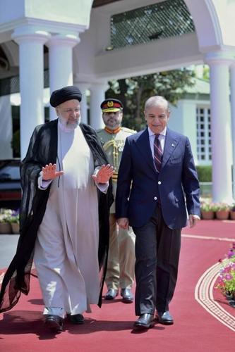 Iran's president holds talks with Pakistani premier after arrival in Islamabad for a 3-day visit
