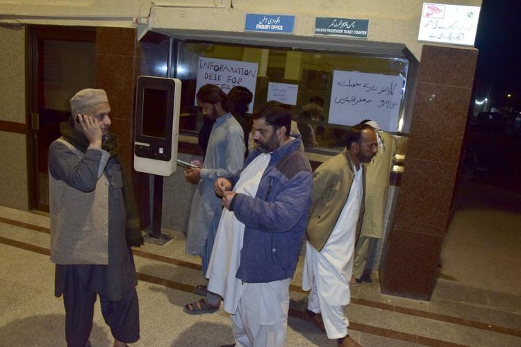 Pakistani insurgents attack a train carrying hundreds of people and take hostages