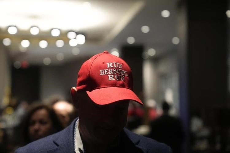 Warnock, Walker push for outright Senate victory in Georgia