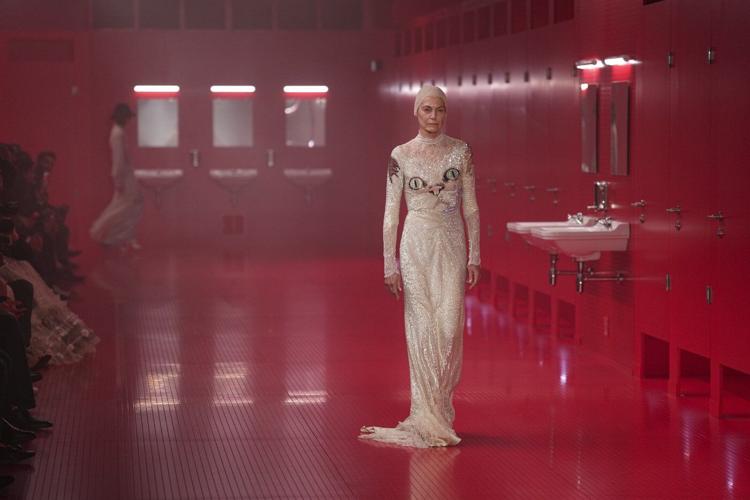 Valentino's Michele upends high fashion by setting Paris show inside staged public toilets