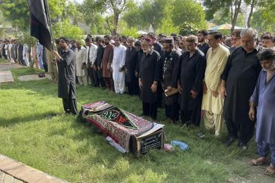 Mourners in southern Pakistan attend funerals for 28 Shiite pilgrims killed in a bus crash in Iran