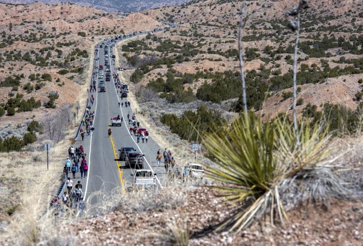 Thousands of pilgrims trek through New Mexico desert to historic adobe church for Good Friday