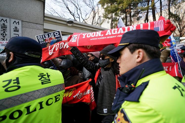 A South Korean court sentences Yoon to 5 years in prison on charges related to martial law decree