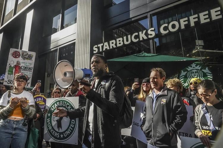 Thousands of Starbucks workers go on a one-day strike on one of the chain's busiest days of year
